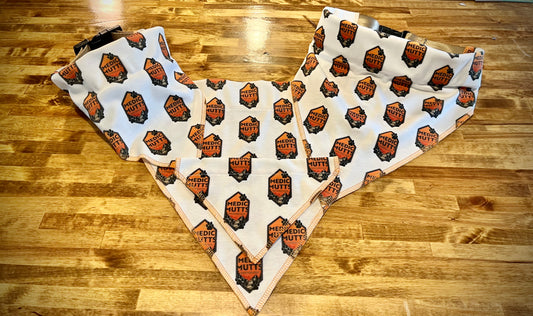 Medium bandana on the left and Large on the right with a 2" collar